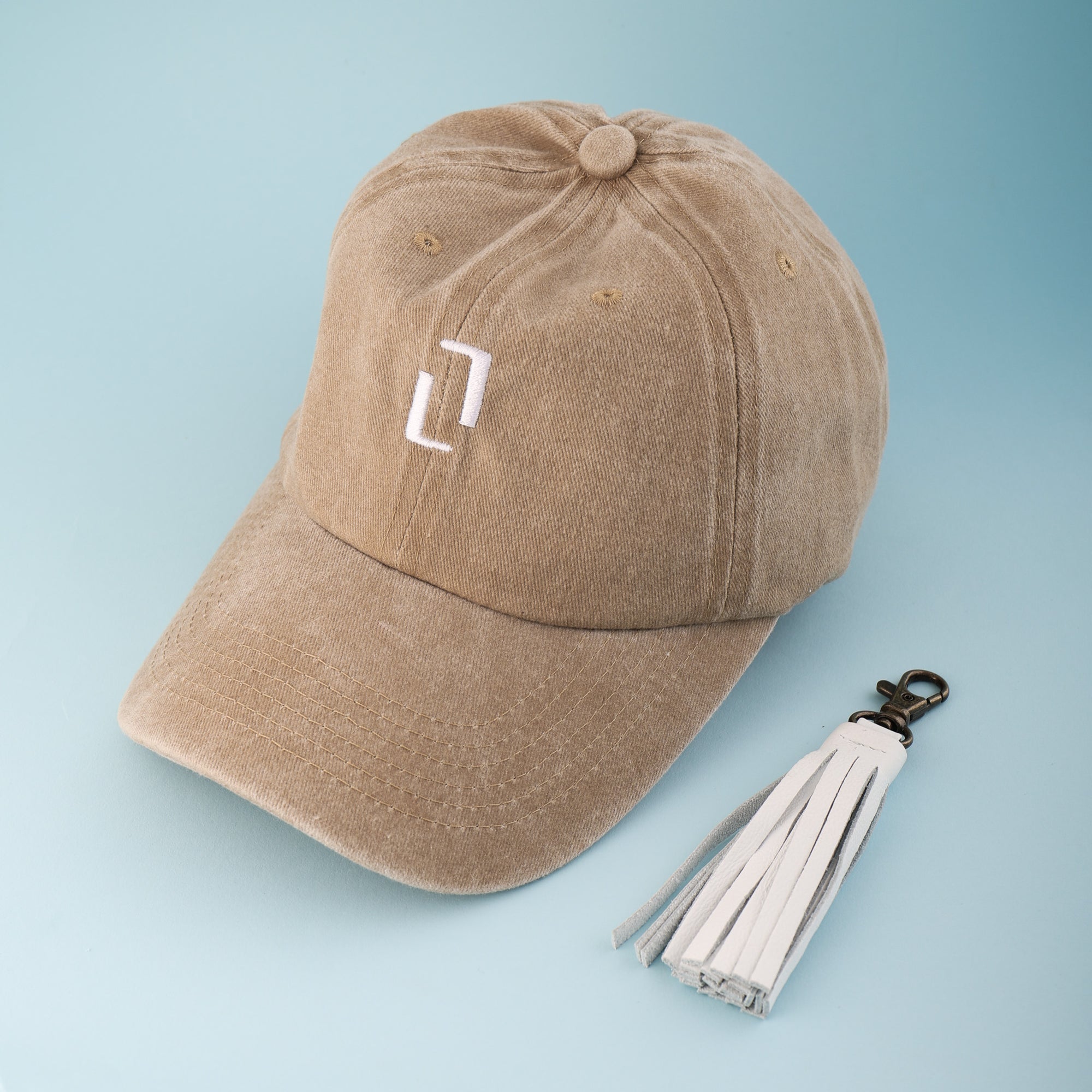 Beige Cap and White Keyring